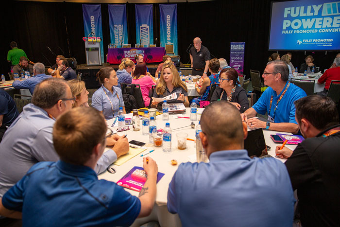 Fully Promoted staff attending a convention